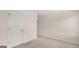 Empty bedroom with two white doors and neutral carpet at 671 Edgar St, Hampton, GA 30228