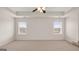 Spacious bedroom with plush carpet and large windows at 671 Edgar St, Hampton, GA 30228