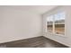 Bonus room with wood-look flooring and a large window at 671 Edgar St, Hampton, GA 30228