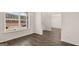 Open concept dining room with wood-look flooring at 671 Edgar St, Hampton, GA 30228