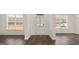 Entryway with wood-look flooring and a front door at 671 Edgar St, Hampton, GA 30228