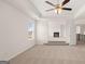Spacious main bedroom with tray ceiling, ceiling fan, and plush carpet at 671 Edgar St, Hampton, GA 30228