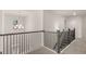 Open staircase with black metal balusters and a view to the floor below at 671 Edgar St, Hampton, GA 30228