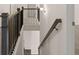 View of the staircase from the bottom with wood and metal railing at 671 Edgar St, Hampton, GA 30228
