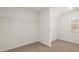 Spacious walk-in closet with wire shelving and carpet at 671 Edgar St, Hampton, GA 30228