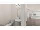 Clean powder room with a pedestal sink and view of kitchen at 663 Edgar St # 25, Hampton, GA 30228