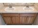 Bathroom vanity with double sinks and wooden cabinets at 5330 Creekview Ln, Morrow, GA 30260