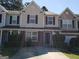 Two-story townhome with attached garage and driveway at 5330 Creekview Ln, Morrow, GA 30260