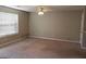 Empty living room with beige carpet and ceiling fan at 5330 Creekview Ln, Morrow, GA 30260