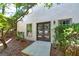 Backyard view of the house with French doors and landscaping at 436 Winged Foot Dr, Mcdonough, GA 30253