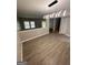 Dining room with stylish lighting, wood-look floors, and a view to the living room at 2033 Oak Park Ln, Decatur, GA 30032