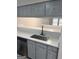 Kitchen pass-through with stainless steel sink and white countertops at 2033 Oak Park Ln, Decatur, GA 30032