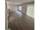 Living room with wood-look flooring and sliding glass door at 2033 Oak Park Ln, Decatur, GA 30032