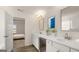 Main bathroom with double vanity, a view into bedroom, and modern fixtures at 1723 Goodwin, Hampton, GA 30228