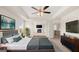 Main bedroom with ceiling fan, en-suite bathroom access, and sitting area at 1723 Goodwin, Hampton, GA 30228