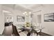 Bright dining room with glass table and modern chandelier at 1723 Goodwin, Hampton, GA 30228