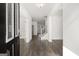 Light-filled entryway with hardwood floors leading to the living spaces at 1723 Goodwin, Hampton, GA 30228