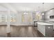 Modern kitchen with gray cabinets, island, and stainless steel appliances at 1723 Goodwin, Hampton, GA 30228