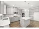 Modern kitchen with gray cabinets, quartz countertops, and stainless steel appliances at 1723 Goodwin, Hampton, GA 30228