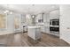 Eat-in kitchen with island, gray cabinets, and hardwood floors at 1723 Goodwin, Hampton, GA 30228