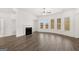 Spacious living room with hardwood floors, fireplace, and large windows at 1723 Goodwin, Hampton, GA 30228