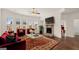 Living room with fireplace and red velvet furniture at 1723 Goodwin, Hampton, GA 30228