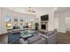 Bright living room featuring a cozy fireplace and comfortable seating at 1723 Goodwin, Hampton, GA 30228