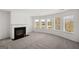 Cozy living room with a modern electric fireplace and large windows at 1723 Goodwin, Hampton, GA 30228