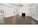 Bright living room featuring hardwood floors, fireplace, and large windows at 1723 Goodwin, Hampton, GA 30228