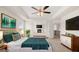 Spacious main bedroom with TV, fireplace, and access to upper level at 1723 Goodwin, Hampton, GA 30228