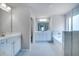 Elegant bathroom with double vanity, soaking tub, and shower at 655 Edgar St, Hampton, GA 30228