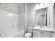 Clean bathroom with a tub, toilet, and vanity with a mirror at 655 Edgar St, Hampton, GA 30228
