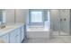 Spa-like bathroom with soaking tub and walk-in shower at 655 Edgar St, Hampton, GA 30228