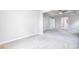 Large bedroom with plush carpeting and views to backyard at 655 Edgar St, Hampton, GA 30228