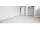 Bright bedroom with carpet and double door closet at 655 Edgar St, Hampton, GA 30228