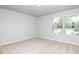 Spacious bedroom with carpet and window at 655 Edgar St, Hampton, GA 30228