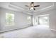 Spacious primary bedroom with high ceilings and ample natural light at 655 Edgar St, Hampton, GA 30228
