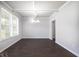 Formal dining room with hardwood floors and elegant chandelier at 655 Edgar St, Hampton, GA 30228