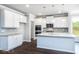 Kitchen with white cabinets and granite at 655 Edgar St, Hampton, GA 30228