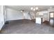 Open living room with hardwood floors, fireplace, and kitchen island at 655 Edgar St, Hampton, GA 30228