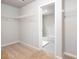 Spacious walk-in closet with wire shelving and carpeted flooring at 655 Edgar St, Hampton, GA 30228