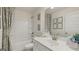 Stylish bathroom with tub, sink, and decorative accents at 667 Edgar # 26, Hampton, GA 30228