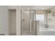 Clean bathroom with a shower and linen closet at 667 Edgar # 26, Hampton, GA 30228