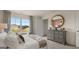 Bright bedroom with large window, dresser, and comfortable bed at 667 Edgar # 26, Hampton, GA 30228