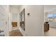 Bright hallway with hardwood floors and large mirrors at 667 Edgar # 26, Hampton, GA 30228