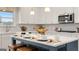 Kitchen island with seating and quartz countertops at 667 Edgar # 26, Hampton, GA 30228
