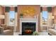 Cozy living room features a fireplace and large windows at 667 Edgar # 26, Hampton, GA 30228