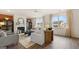 Spacious living room featuring a fireplace and ample natural light at 667 Edgar # 26, Hampton, GA 30228
