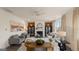 Bright living room with comfortable seating and a cozy fireplace at 667 Edgar # 26, Hampton, GA 30228