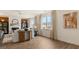 Open living area showcasing hardwood floors and large windows at 667 Edgar # 26, Hampton, GA 30228